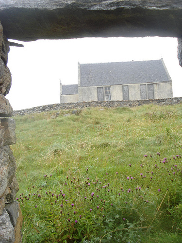 View from ruined home of Margaret Teresa McBain looking at old Torlum  school house, Benbecula